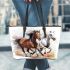 Three horses are galloping in the wind leather tote bag