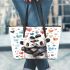 Two cute pandas hugging surrounded colorful hearts leather tote bag