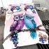 Two cute purple and blue owls sitting on the branch bedding set