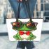 Vector cartoon of green frog wearing sunglasses and red bow tie leaather tote bag