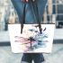Watercolor dragonfly sitting on flower leather tote bag