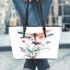 Watercolor dragonfly sitting on flower leather tote bag