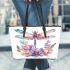 Watercolor dragonfly surrounded in the style of flowers leather tote bag