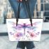 Watercolor dragonfly surrounded in the style of flowers leather tote bag