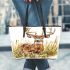 Whitetail deer buck standing in tall grass with daisies leather totee bag