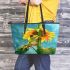 Adorable cartoon frog hanging onto the stem of a sunflower in full bloom leaather tote bag