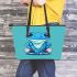 Adorable sitting blue tree frog wearing sneakers leaather tote bag
