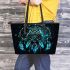 An illustration of an owl sitting on a dream catcher leather tote bag