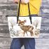 Baby deer in the snow leather totee bag