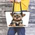 Baby yorkshire terrier puppy in full body isolated leather tote bag