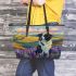 Black and white border collie sits in the foreground of an oil painting leather tote bag