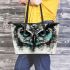 Black and white owl with turquoise highlights leather tote bag