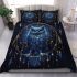 Blue owl sitting on an intricate dreamcatcher bedding set