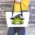 Cartoon green frog with black witch hat leaather tote bag