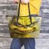 Cats and yellow grinchy smile toothless like leather tote bag