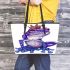 Crown on top of purple and blue tree frog cartoon caricature leaather tote bag