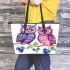 Cute and adorable two purple and pink owls sitting on the branch leather tote bag