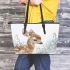 Cute baby deer in the snow leather totee bag