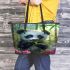 Cute baby panda eating bamboo leather tote bag