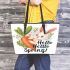 Cute bunny sitting on top of an carrot hello spring leather tote bag