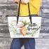 Cute bunny sitting on top of an carrot hello spring leather tote bag