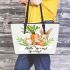 Cute bunny sitting on top of an carrot hello spring leather tote bag