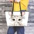 Cute cartoon bunny with big eyes sitting on the flowers leather tote bag