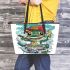 Cute cartoon frog eating ramen shown in a full body shot leaather tote bag