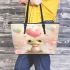 Cute cartoon frog holding a pink heart leaather tote bag