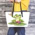 Cute cartoon frog sitting on a lily pad leaather tote bag