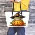 Cute cartoon frog wearing a witch hat sitting on a pumpkin leaather tote bag