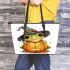 Cute cartoon frog wearing a witch hat sitting on a pumpkin leaather tote bag