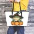 Cute cartoon frog wearing a witch's hat sitting on a pumpkin leaather tote bag