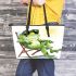 Cute cartoon frog wearing sunglasses lounging in the sun leaather tote bag