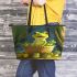 Cute cartoon green frog sitting on top of a bowl leaather tote bag