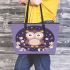 Cute cartoon owl sitting on a branch leather tote bag