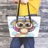 Cute cartoon owl with big eyes wearing a colorful leather tote bag