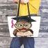 Cute cartoon owl with glasses and graduation hat holding book leather tote bag