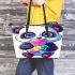 Cute cartoon panda holding a colorful bubble leather tote bag