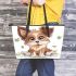 Cute cartoon puppy sits on the ground with its paws spread leather tote bag