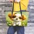 Cute cartoon puppy sitting on the grass leather tote bag