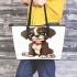 Cute cartoon puppy sitting with red collar leather tote bag