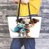 Cute cartoon puppy with a blue backpack leather tote bag