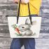 Cute cartoon rabbit holding a carrot leather tote bag