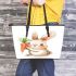 Cute cartoon rabbit holding a carrot leather tote bag