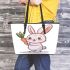 Cute cartoon rabbit holding a carrot leather tote bag