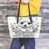 Cute cartoon style puppy sitting in flower basket leather tote bag