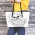 Cute cartoon style puppy sitting in flower basket leather tote bag