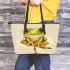 Cute chibi frog sitting on a pencil leaather tote bag