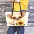 Cute chihuahua puppy with big eyes sitting next to sunflower leather tote bag